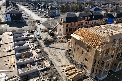 Townhouses under construction are seen in a subdivision in King City, Ontario, Canada April 2, 2023.