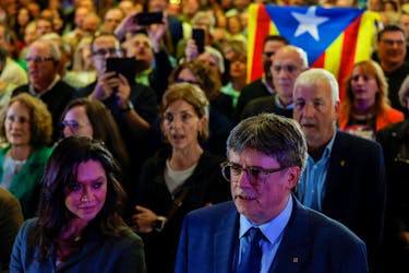 Catalan separatist leader Carles Puigdemont and his wife Marcela Topor attend an event to announce his candidature with Junts Per Catalunya (Together for Catalonia) party for Catalonia's May 12 election, in Elne, France March 21, 2024.