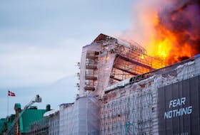 A firefighter works as fire burns at the Old Stock Exchange, Boersen, in Copenhagen, Denmark April 16, 2024.  Ritzau Scanpix/Ida Marie Odgaard/via REUTERS