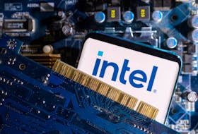 A smartphone with a displayed Intel logo is placed on a computer motherboard in this illustration taken March 6, 2023.