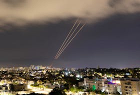An anti-missile system operates after Iran launched drones and missiles towards Israel, as seen from Ashkelon, Israel April 14, 2024.