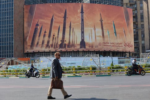 An anti-Israel billboard with a picture of Iranian missiles is seen in a street in Tehran, Iran April 15, 2024. Majid Asgaripour/WANA (West Asia News Agency) via