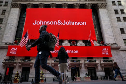 A Johnson & Johnson banner is displayed on the front of the New York Stock Exchange (NYSE) in New York City, in New York City, U.S., December 5, 2023. 