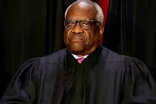 U.S. Supreme Court Justice Clarence Thomas poses during a group portrait at the Supreme Court in Washington, U.S., October 7, 2022.