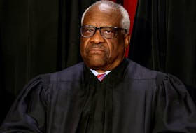 U.S. Supreme Court Justice Clarence Thomas poses during a group portrait at the Supreme Court in Washington, U.S., October 7, 2022.
