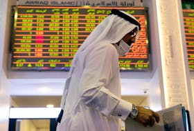 An investor walks through the Dubai Financial Market after Joe Biden won the U.S. presidency, in Dubai, United Arab Emirates November 8, 2020.