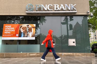 A person walks past a branch of PNC Bank, a subsidiary of PNC Financial Services Group, in Washington, U.S. April 30, 2023. 