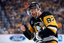 Pittsburgh Penguins centre Sidney Crosby prepares his stick before a face-off during Monday's game against the Nashville Predators at PPG Paints Arena in Pittsburgh. - Charles LeClaire-USA TODAY Sports