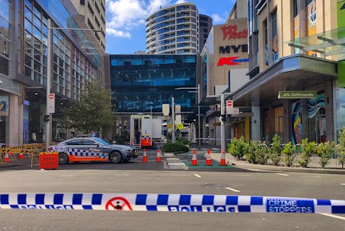 A view of a police car outside Westfield Bondi Junction as the mall remains under lockdown following Saturday’s stabbings in Sydney, Australia April 14, 2024.