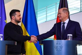 German Chancellor Olaf Scholz and Ukraine's President Volodymyr Zelenskiy shake hands at a press conference in Berlin, Germany, February 16, 2024.