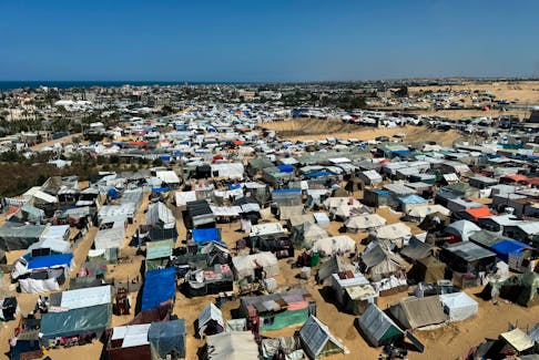 Displaced Palestinians, who fled their houses due to Israeli strikes, shelter in a tent camp, amid the ongoing conflict between Israel and the Palestinian Islamist group Hamas, in Rafah, in the southern Gaza Strip March 11, 2024.