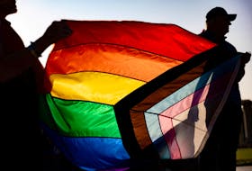 People participate in an event to raise Bucks County's Pride Flag to kick off Pride Month in Doylestown, Pennsylvania, U.S., June 1, 2023.