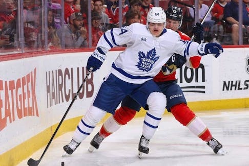 Anton Lundell #15 of the Florida Panthers and David Kampf #64 of the Toronto Maple Leafs battle for control of the puck during second period action at the Amerant Bank Arena on April 16, 2024 in Sunrise, Florida.