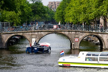 Tourists boats pass on a canal in Amsterdam, Netherlands, May 16, 2018. Picture taken May 16, 2018. 