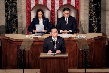 Japanese Prime Minister Fumio Kishida addresses a joint meeting of Congress, as U.S. Vice President Kamala Harris and House Speaker Mike Johnson (R-LA) listen, at the U.S. Capitol in Washington, U.S., April 11, 2024.
