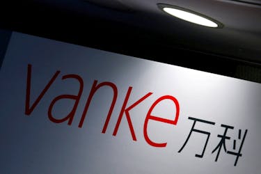 The company logo of China Vanke is displayed at a news conference announcing the property developer's interim results in Hong Kong, China August 22, 2016. 