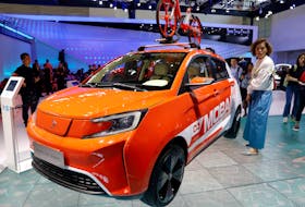 File photo: People gather around the Sitech DEV1 from FAW Group during a media preview of the Auto China 2018 motor show in Beijing, China April 25, 2018.