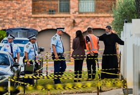 Police enter the Assyrian Christ The Good Shepherd Church with a clergyman after a knife attack took place during a service on Monday night, in Wakely, in Sydney, Australia, April 17, 2024.