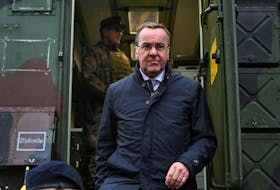 German Defence Minister Boris Pistorius steps out of a container during his visit at the German army's communications center responsible for cybersecurity in Mayen, Germany, April 16, 2024.