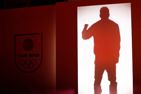 Japan's volleyball player Yuji Nishida is silhouetted at an unveiling ceremony of official uniforms for the Paris Olympics and Paralympics in Tokyo, Japan April 17, 2024.
