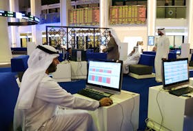 Investors are seen at the Dubai International Financial Market in Dubai, UAE February 7, 2018.