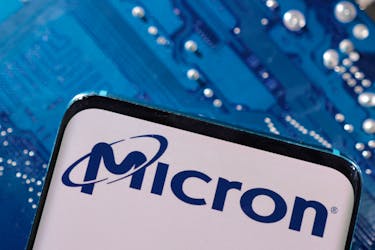 A smartphone with a displayed Micron logo is placed on a computer motherboard in this illustration taken March 6, 2023.