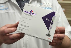 A pharmacist displays a box of Mounjaro, a tirzepatide injection drug used for treating type 2 diabetes made by Lilly at Rock Canyon Pharmacy in Provo, Utah, U.S. March 29, 2023.