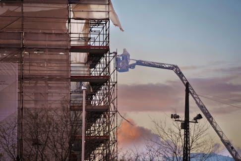 An Emergency management worker works following the fire in the building of the Old Stock Exchange, Boersen, in Copenhagen, Denmark April 17, 2024.  Ritzau Scanpix/via REUTERS