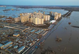A drone view shows a flooded area around the Dubki residential complex in Orenburg, Russia, April 12, 2024.