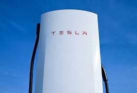 A detail of a Tesla electric vehicle charging station is pictured on a car park of the A10 shopping center in Wildau near Berlin, Germany, March 20, 2024.