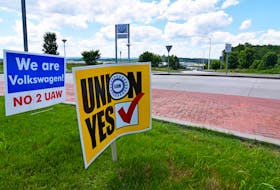 Signs stand outside a Volkswagen plant during a vote among local workers over whether or not to be represented by the United Auto Workers union in Chattanooga, Tennessee, U.S. June 13, 2019.