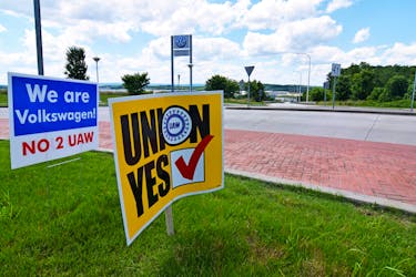 Signs stand outside a Volkswagen plant during a vote among local workers over whether or not to be represented by the United Auto Workers union in Chattanooga, Tennessee, U.S. June 13, 2019.