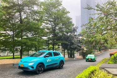 A VinFast electric taxi, operated by GSM, a private company owned by VinFast's owner, passes by a street, in Hanoi, Vietnam April 7, 2024.