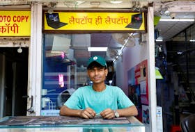 Mohammad Ajaz Ansari, 19, a laptop repairer and first-time voter, poses for a photograph outside a repair shop ahead of India's general election, in New Delhi, India, April 10, 2024. "There are so many unemployed people. Many people in my locality keep asking for work, but they don't get any. They work for private firms for a meagre amount of 10,000 -12,000 rupees (per month) (119 – 143USD) , which is not enough for a household to survive," said Mohammad Aijaz Ansari during an interview with Reuters.