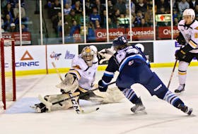 Cape Breton Eagles goaltender Nicolas Ruccia, left, makes a right pad save on Samuel Vachon of the Chicoutimi Saguenéens during Game 4 of the Quebec Maritimes Junior Hockey League second-round playoff series at Centre Georges-Vézina in Chicoutimi, Que., on Wednesday. Cape Breton won the game 8-5 and wins the series 4-0. CONTRIBUTED/BRUNO GIRARD
