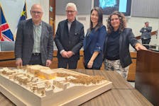 Architects Diamond Schmidt presented a new scale model of the proposed New Brunswick Museum expansion Tuesday at a meeting of the city's planning advisory board. Tracy Clinch, chair of the museum board, is seen at right with Donald Schmidt and project architect Emily Baxter in the centre and Michael Leckman at left.