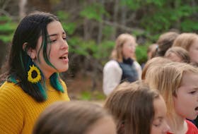 Emma Stevens, who saw popular reaction to her Mi'kmaw language cover of the song 'Blackbird' by The Beatles in 2019, sings the chorus of 'We are the Love," alongside students from both Riverside and Marion Bridge Elementary School choirs.  CONTRIBUTED/EYM Project