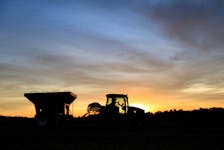 A tractor is silhouetted after harvesting soybeans at a farm in Caaguazu, Paraguay February 17, 2020.
