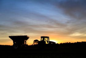 A tractor is silhouetted after harvesting soybeans at a farm in Caaguazu, Paraguay February 17, 2020.