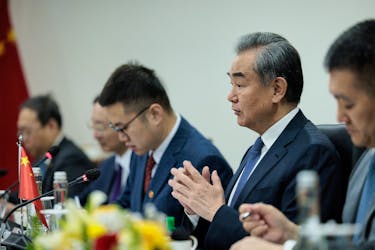 Chinese Foreign Minister Wang Yi gestures during a bilateral meeting with Indonesian Foreign Minister Retno Marsudi in Jakarta, Indonesia, April 18, 2024. Yasuyoshi Chiba/Pool via REUTERS