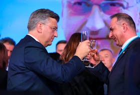 Andrej Plenkovic,  Prime Minister of Croatia, drinks champagne following the preliminary results of the country's parliamentary election, in Zagreb, Croatia, April 17, 2024. 