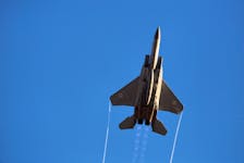 An Israeli air force F-15 fighter jet flies during an exhibition as part of a pilot graduation ceremony at the Hatzerim air base in southern Israel June 26, 2014.
