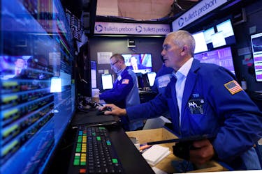 Traders work on the trading floor at the New York Stock Exchange (NYSE) in New York City, U.S., April 4, 2024.