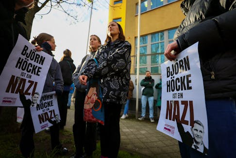 Demonstrators, holding placards that read "Bjoern Hoecke is a Nazi", protest against German far-right politician of the Alternative for Germany (AfD) Bjoern Hoecke on the day of his trial over the alleged use of Nazi vocabulary during a speech in May 2021, at the regional court in the major city of Halle, Germany April 18, 2024.