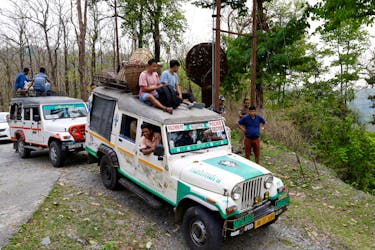 Vehicles carrying election materials move through Buxa Tiger Reserve forest to reach to a remote polling station, ahead of the first phase of India's general election, in Alipurduar district in the eastern state of West Bengal, India, April 18, 2024.