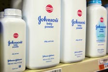 Bottles of Johnson & Johnson baby powder line a drugstore shelf in New York October 15, 2015. 