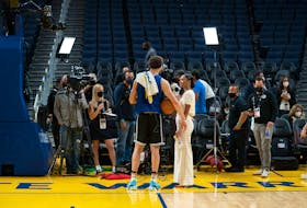 June 1, 2022; San Francisco, CA, USA; Golden State Warriors guard Klay Thompson (11) is interviewed by ESPN on the court during media day of the 2022 NBA Finals at Chase Center. Mandatory Credit: Kyle Terada-USA TODAY Sports/File Photo
