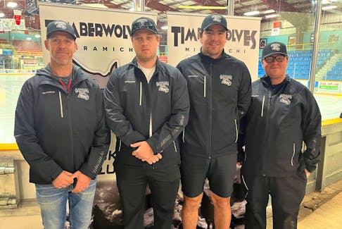 Miramichi Timberwolves general manager Ross Martin, second right, of Winsloe, P.E.I., chats with the Maritime Junior Hockey League (MHL)  team’s coaching staff of, from left, head coach Kory Baker and assistants Billy Gaston and Alex White. The Timberwolves visit the Summerside D. Alex MacDonald Ford Western Capitals for Game 1 of the MHL final series on April 20 at 7 p.m. Contributed