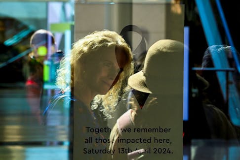People attend Community Reflection Day at Westfield Bondi Junction shopping centre as it re-opens to the public for the first time after the stabbing attacks which killed several people at the shopping centre, in Sydney, Australia, April 18, 2024.