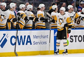 Apr 17, 2024; Elmont, New York, USA;  Pittsburgh Penguins center Jeff Carter (77) celebrates his goal against the New York Islanders during the second period at UBS Arena. Mandatory Credit: Dennis Schneidler-USA TODAY Sports